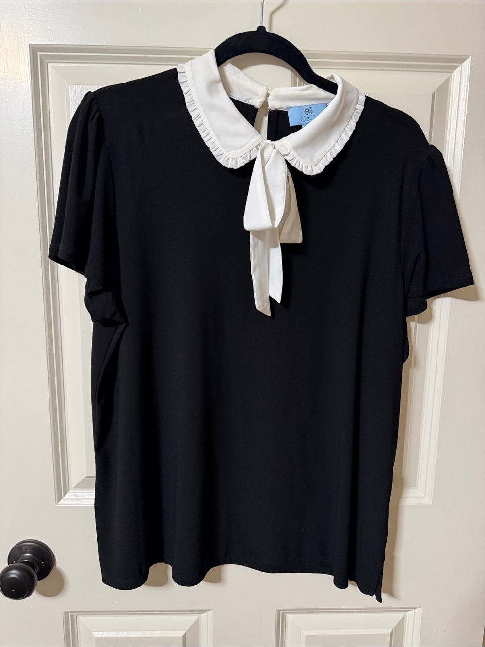 CeCe Black Blouse with White Ruffled Peter Pan Collar and Tie
